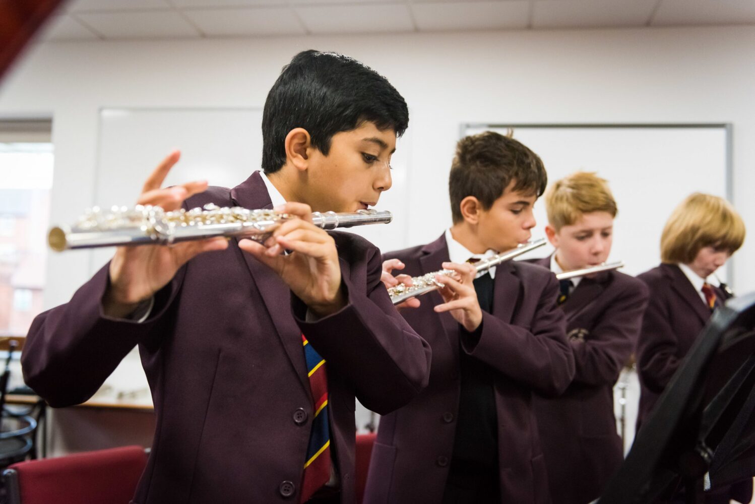 students playing flutes